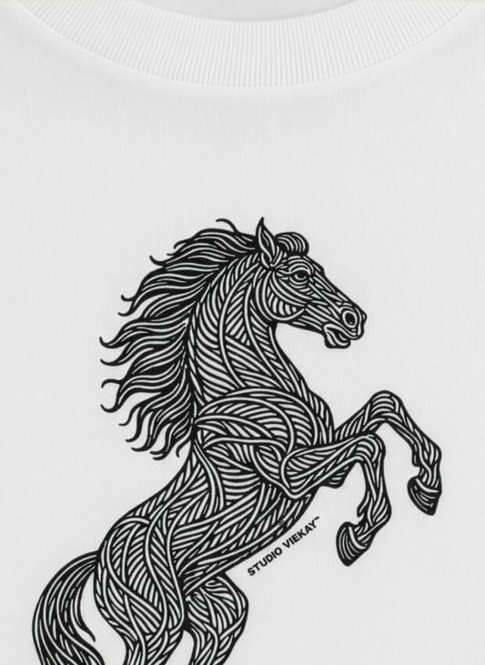 Detail of a Studio Viekay design of a graphic horse on a white tee