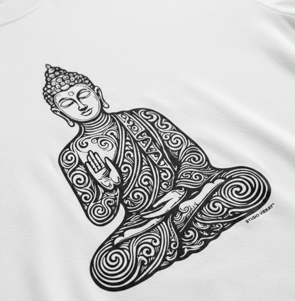 Close-up of a black and white intricate Buddha design on a white t-shirt