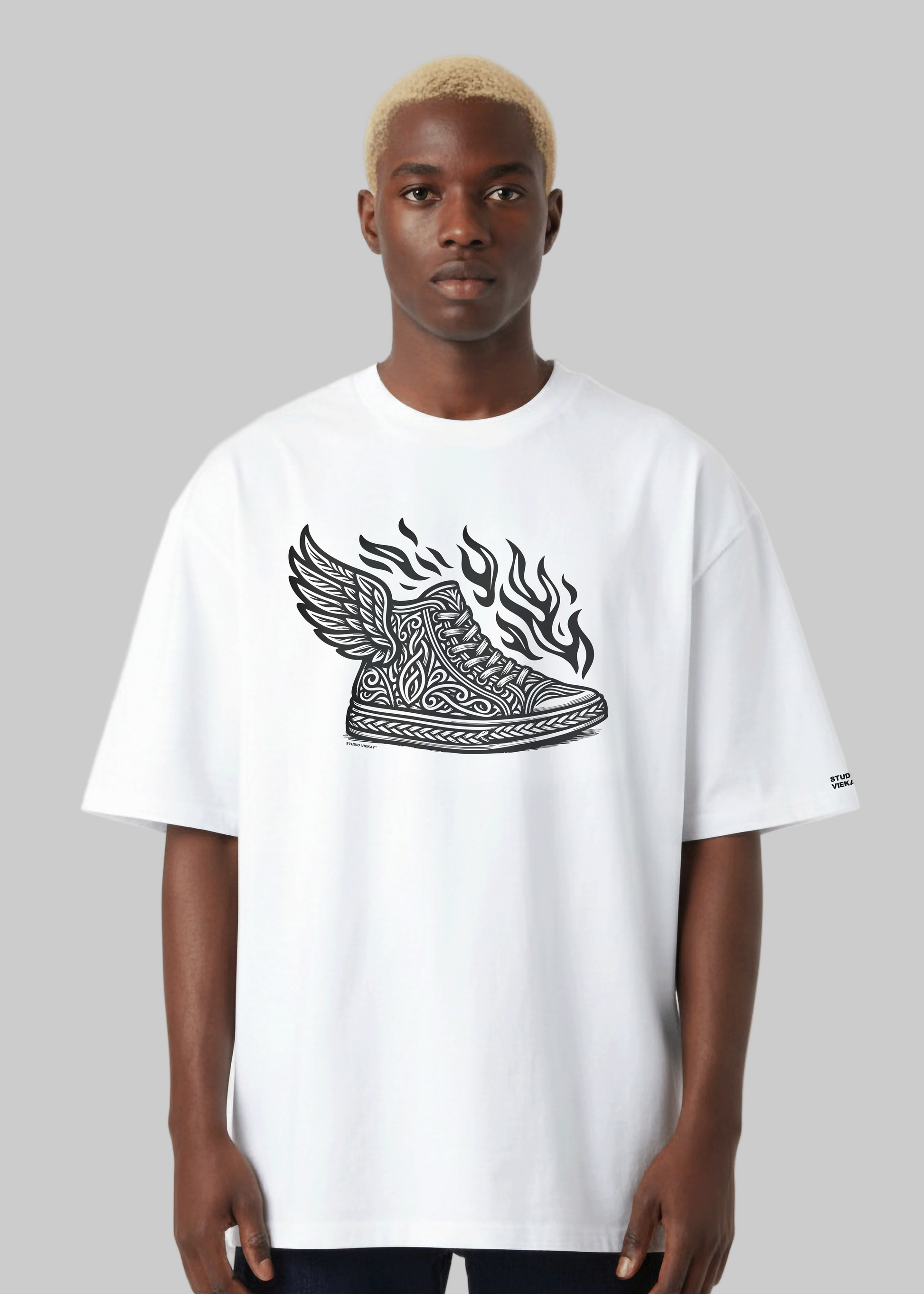 Model wearing Studio Viekay Flying Sneaker Tee with engraved black and white artwork