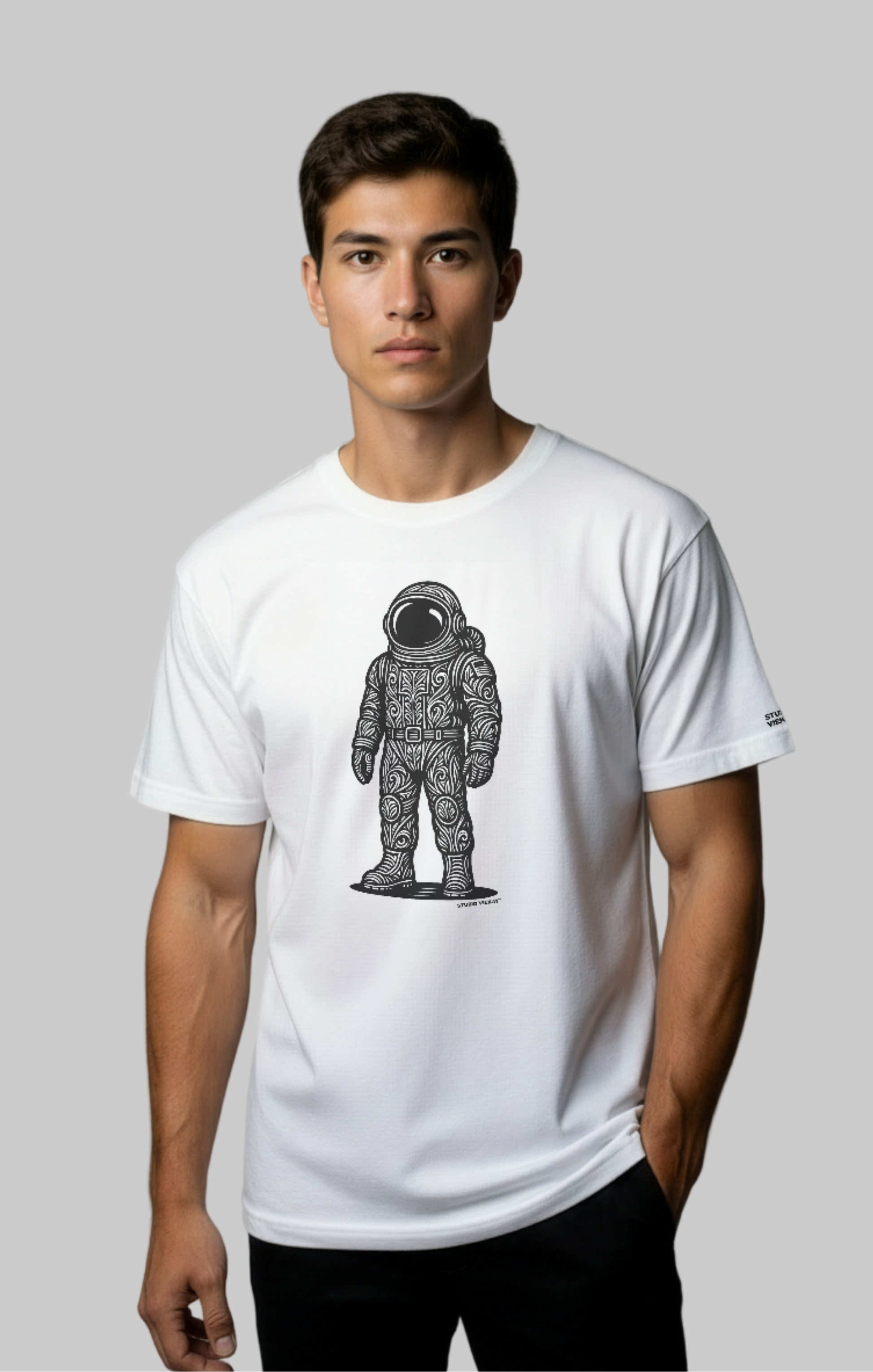 Model wearing the Studio Viekay Astronaut Engraved Art Tee with bold carved astronaut artwork in clean black and white linework