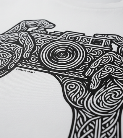 Black and white graphic design of a camera with intricate patterns on a white background, featuring the Studio Vieckay logo.