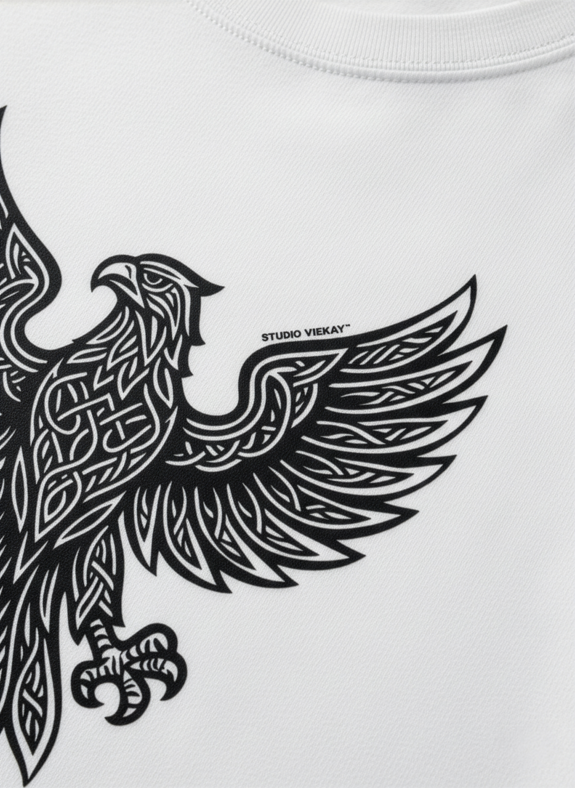 Detail of Studio Viekay white tee depicting eagle graphic