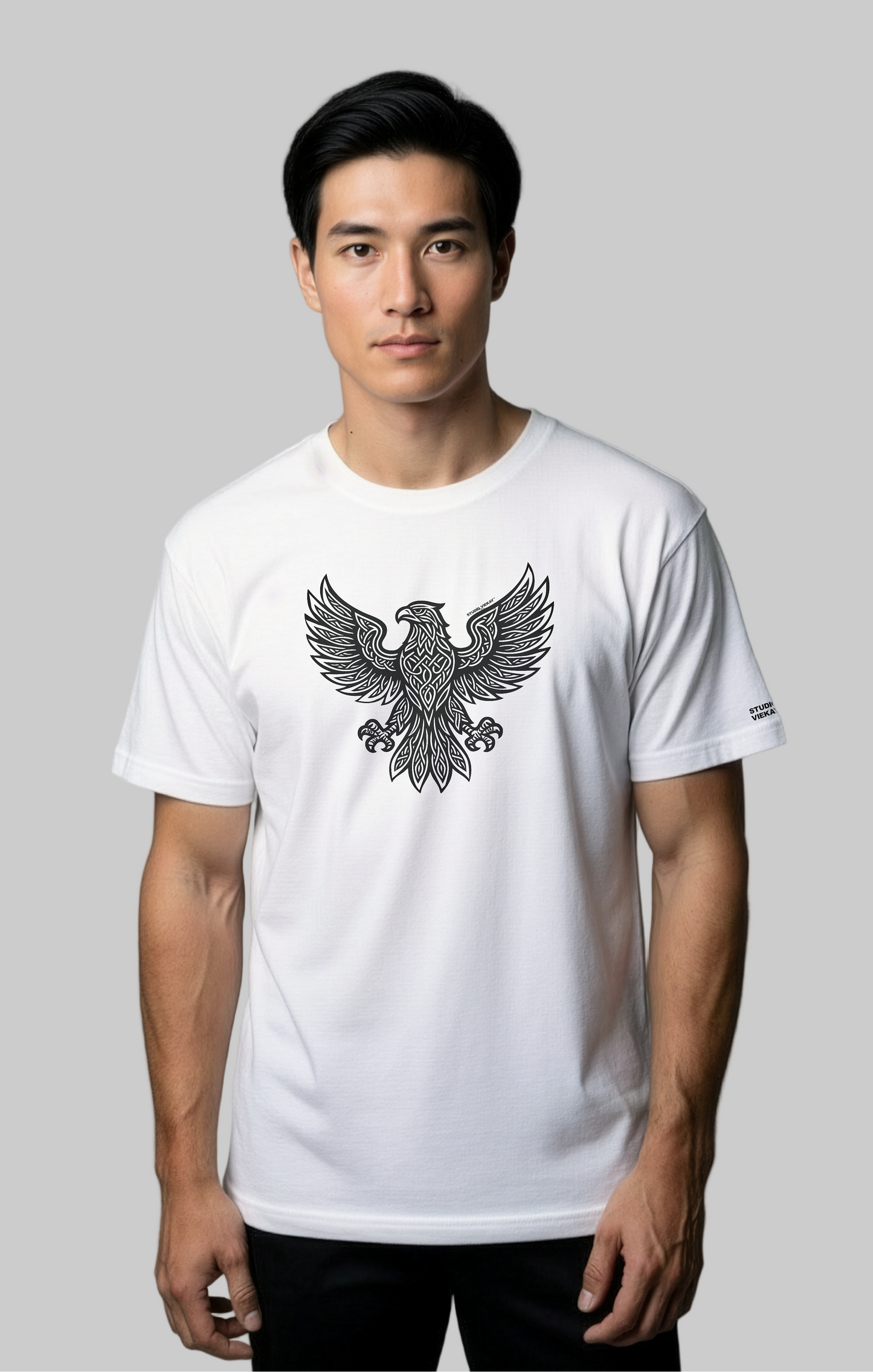 Model wearing the Studio Viekay Eagle Engraved Art Tee with bold carved eagle artwork in clean black and white linework