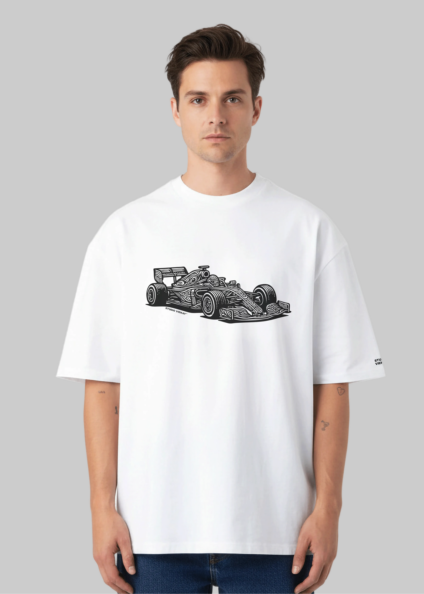 Model wearing Studio Viekay Formula One Engraved Art Box Tee with carved Formula One car artwork