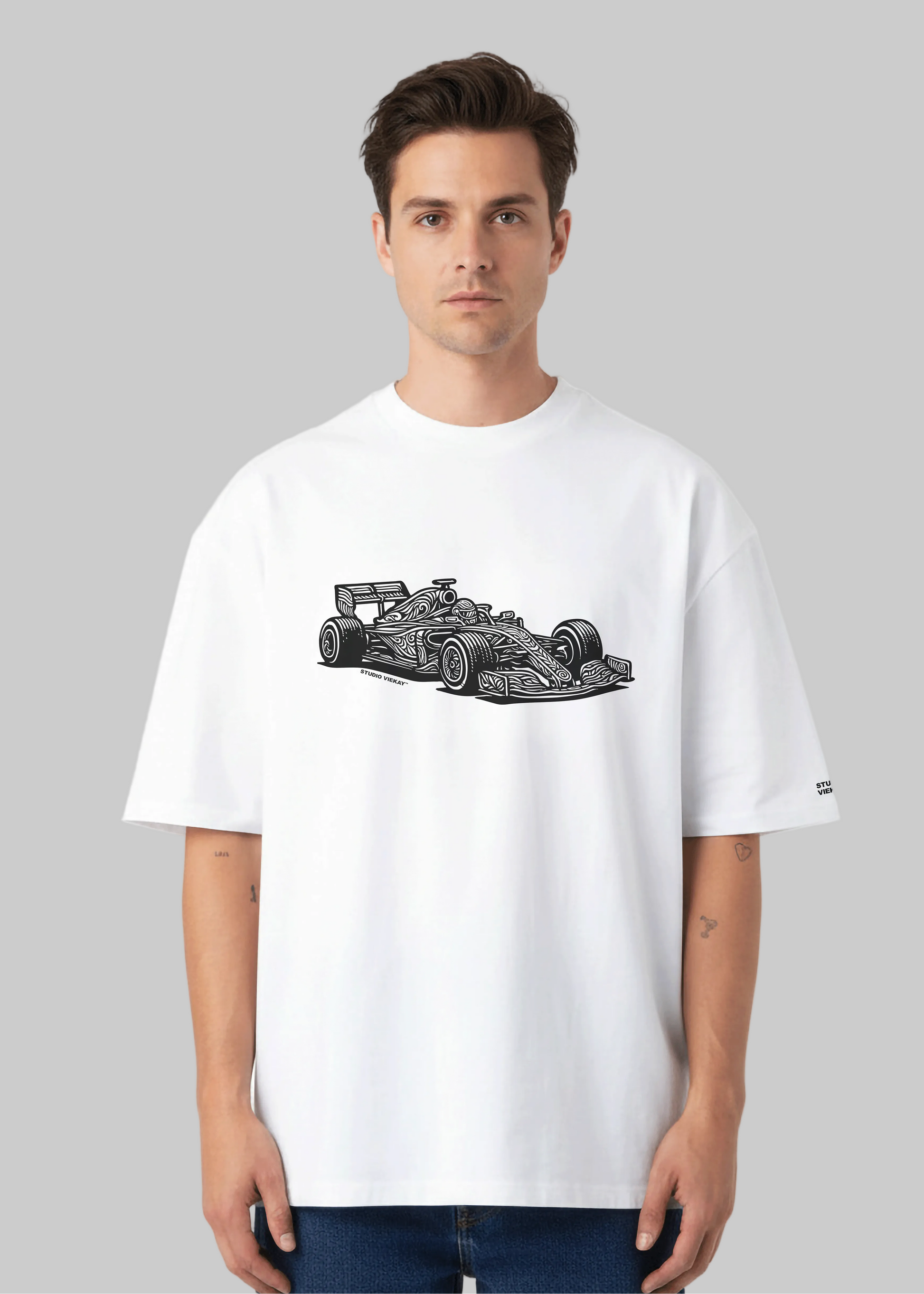 Model wearing Studio Viekay Formula One Engraved Art Box Tee with carved Formula One car artwork