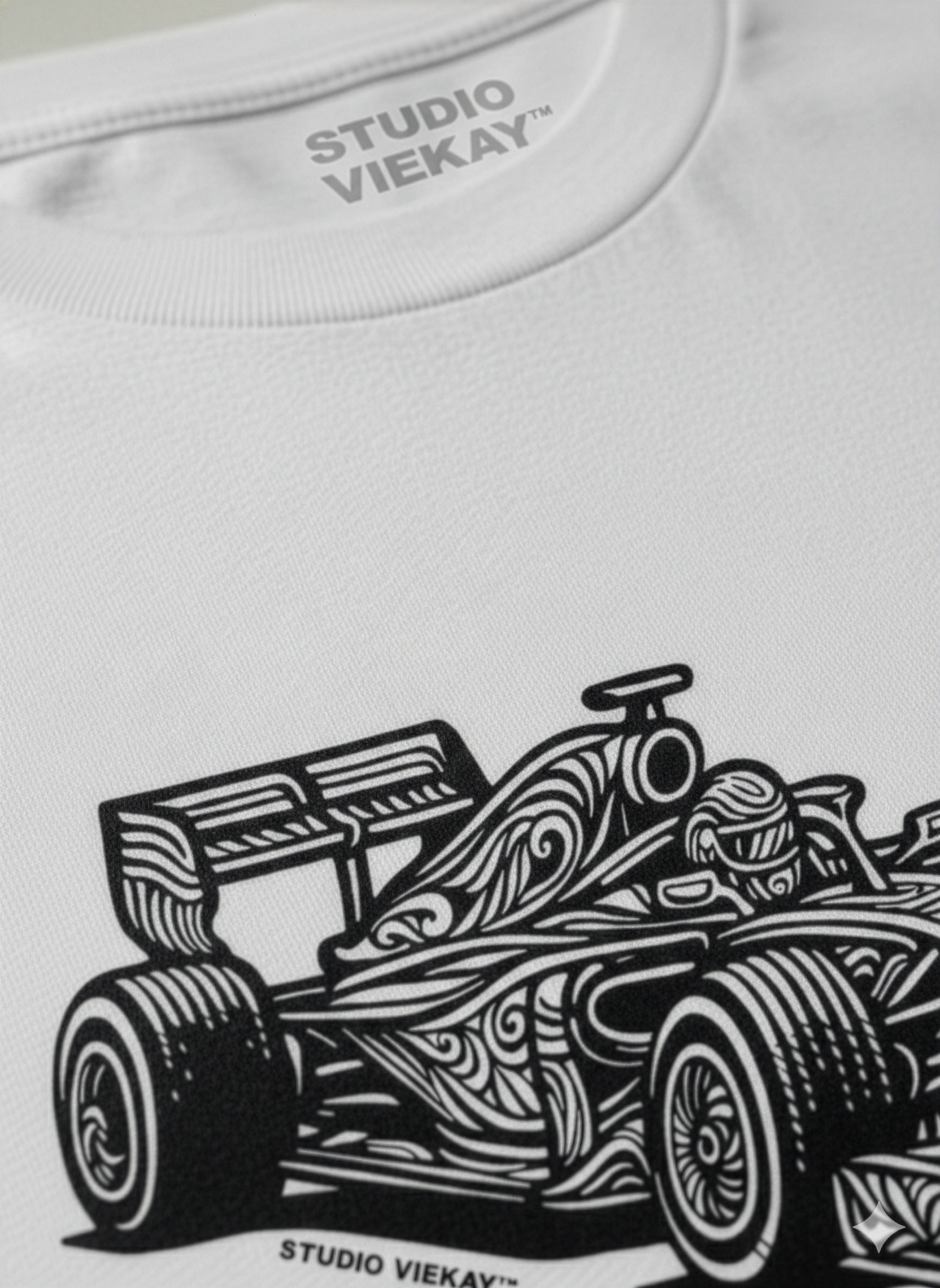 Detail of Studio Viekay graphic across Studio Viekay white tee.