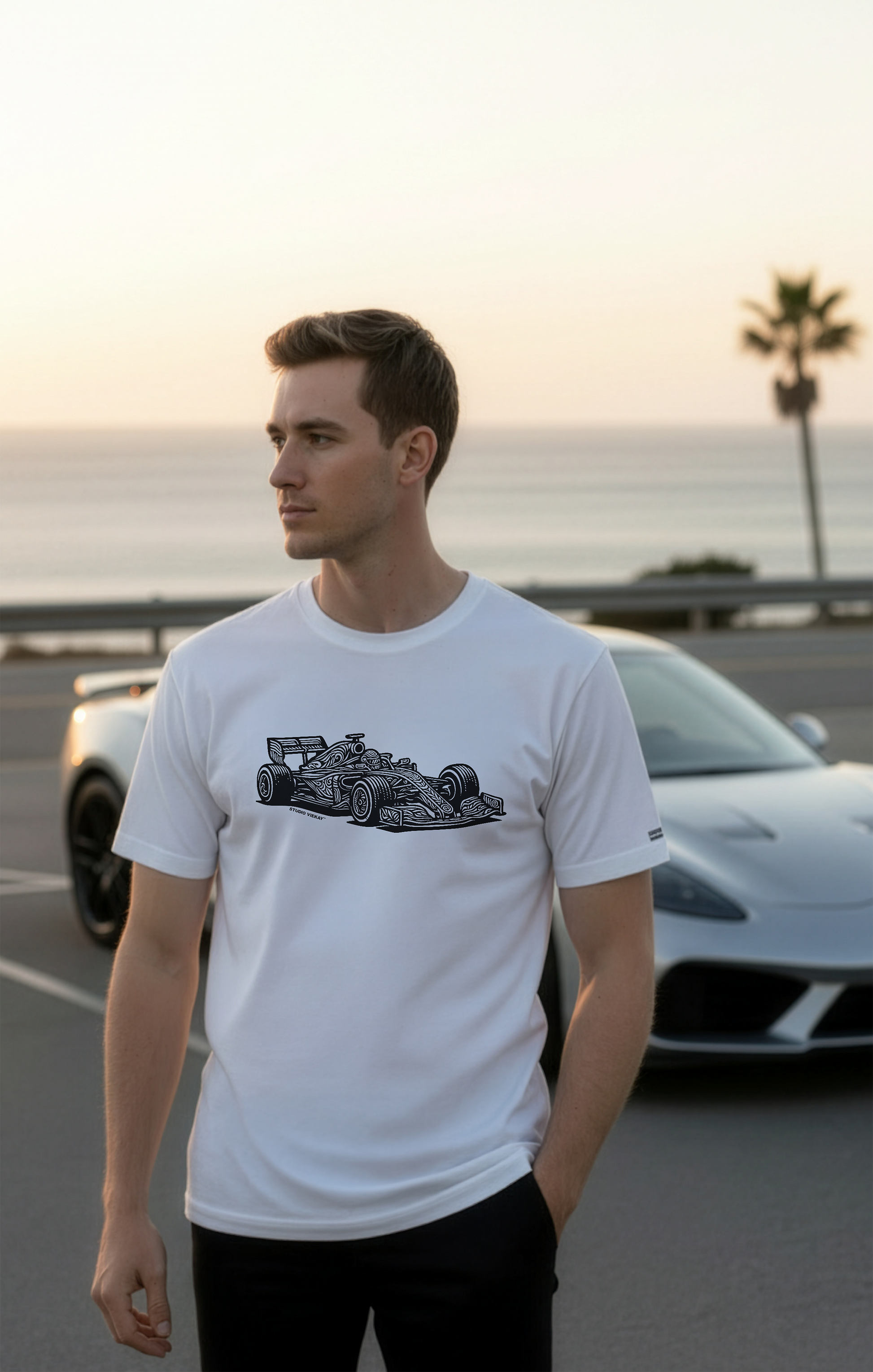 Model wearing a white Studio Viekay t-shirt with a graphic design of a Formula One car.