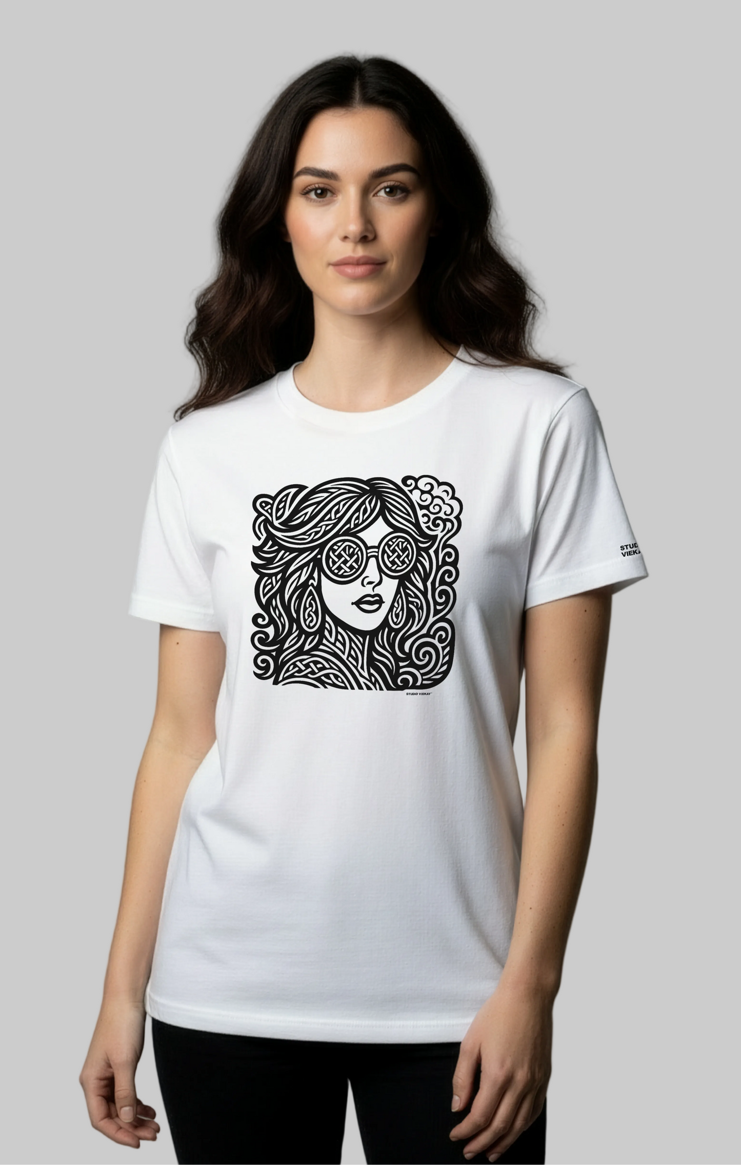 Model wearing a white Studio Viekay  t-shirt with a black graphic design on a gray background