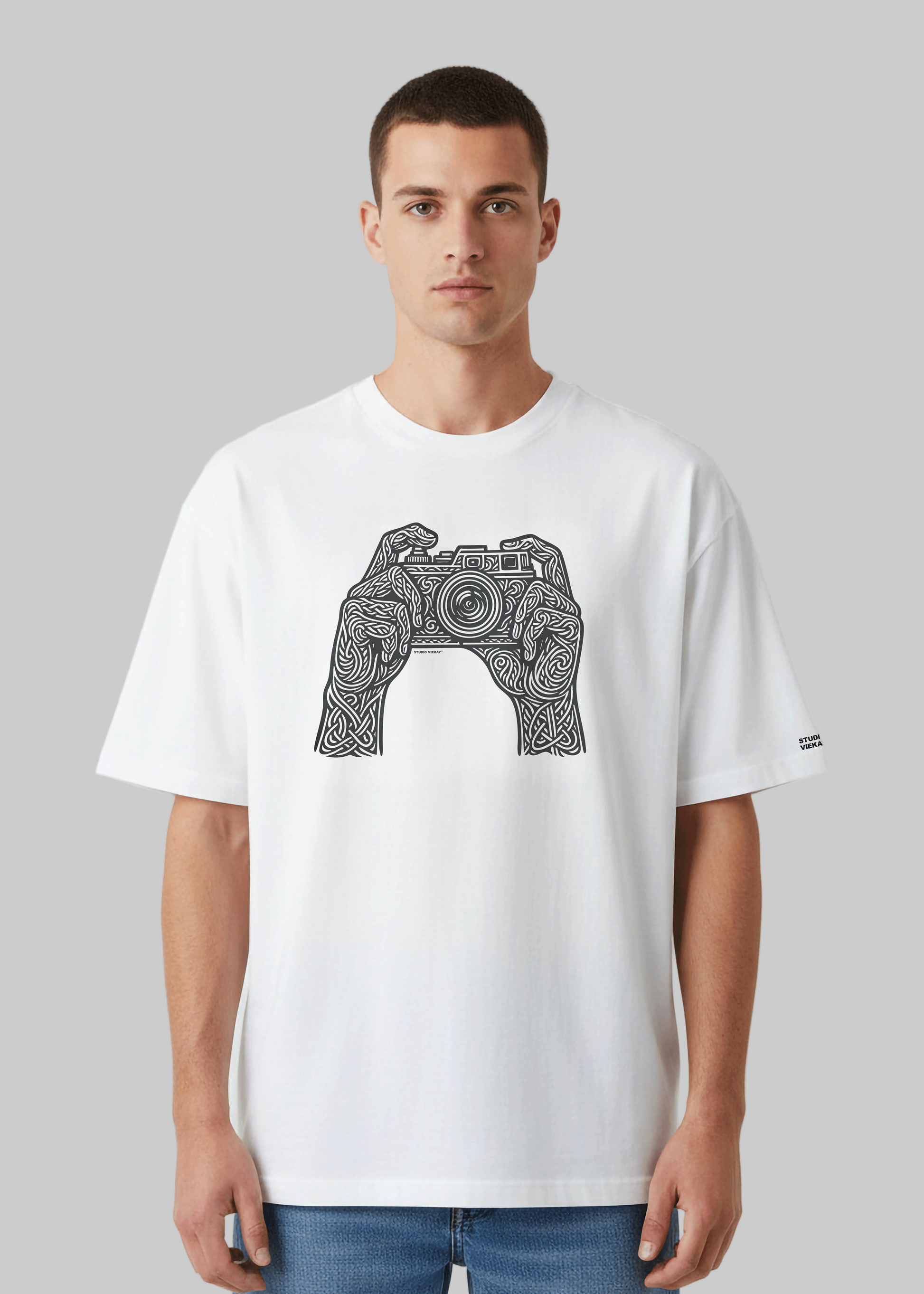 Model wearing Studio Viekay Camera Engraved Art Box Tee with carved camera artwork