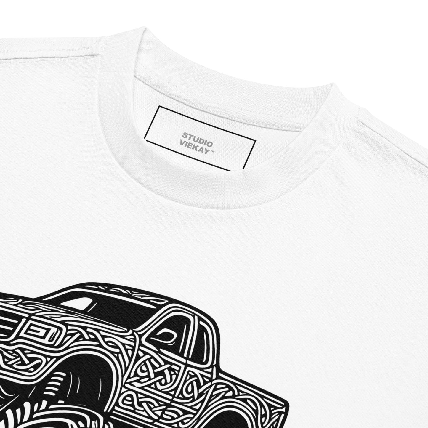 Close up of the Studio Viekay Monster Truck Engraved Art Box Tee showing carved black and white artwork