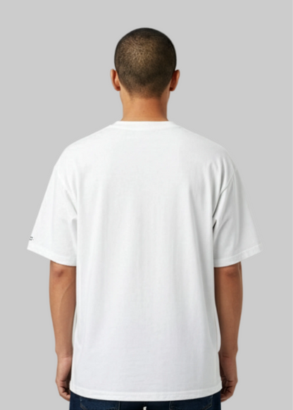 Model wearing a Studio Viekay white t-shirt against a gray background