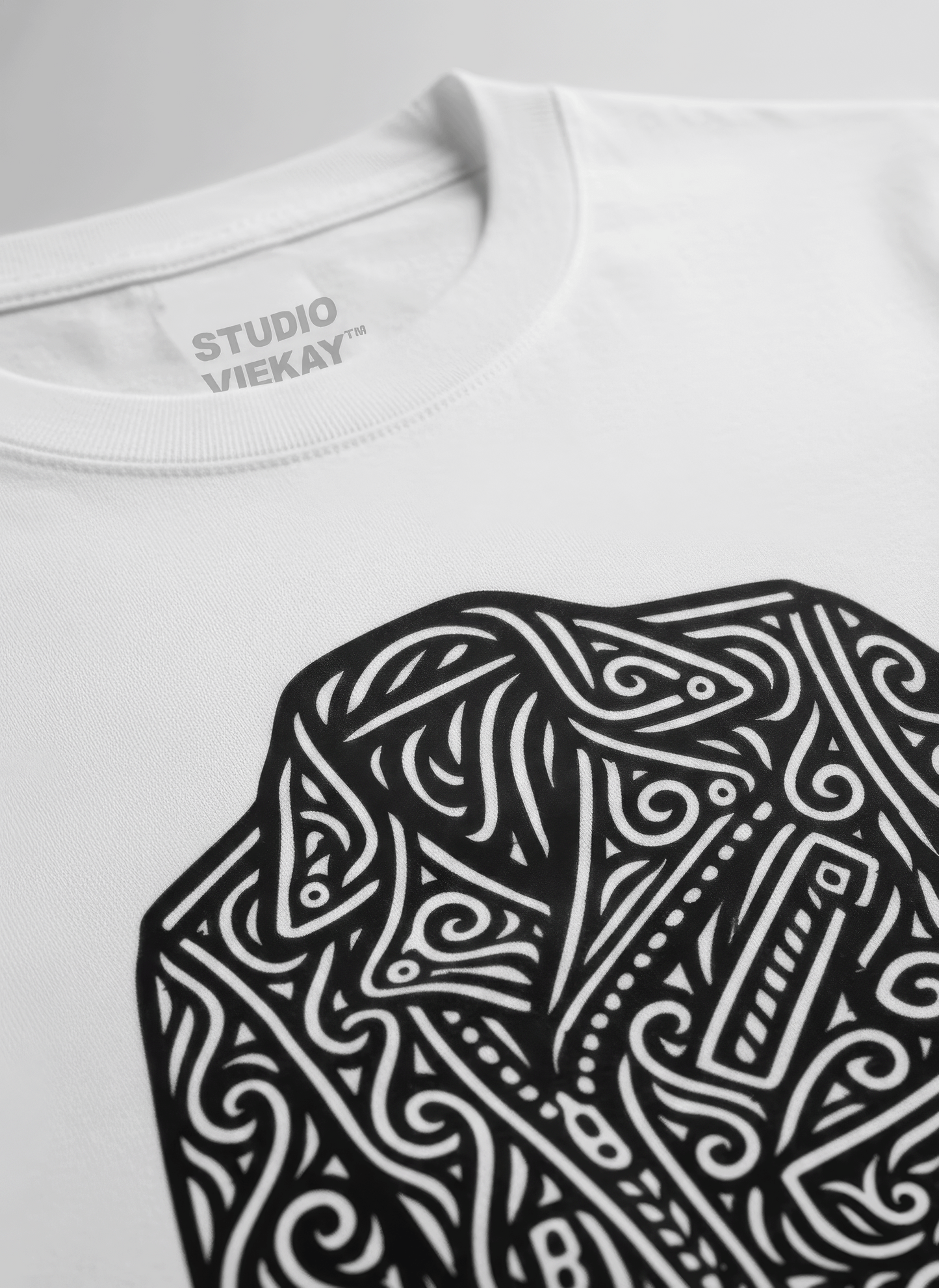 White t-shirt with graphical design of a motorcycle jacket in 'Studio VieKay' branding.