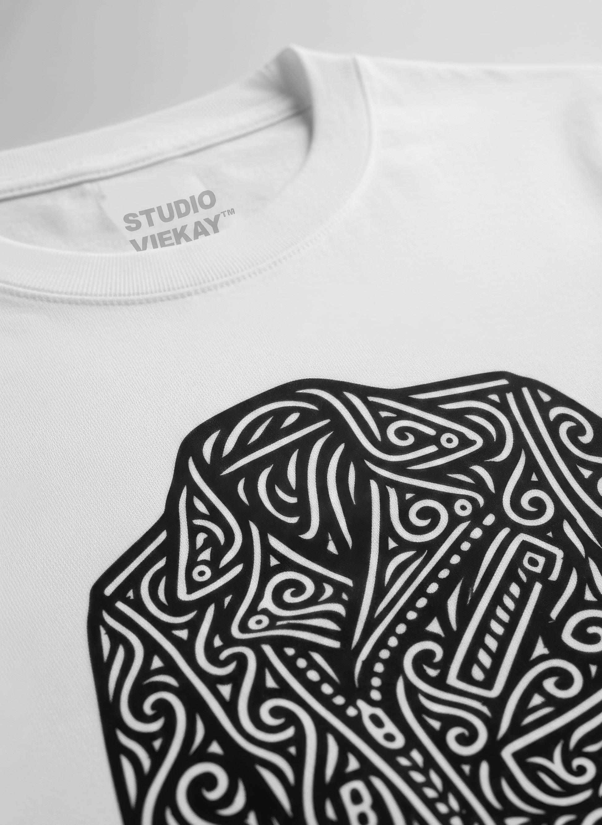 White t-shirt with graphical design of a motorcycle jacket in 'Studio VieKay' branding.