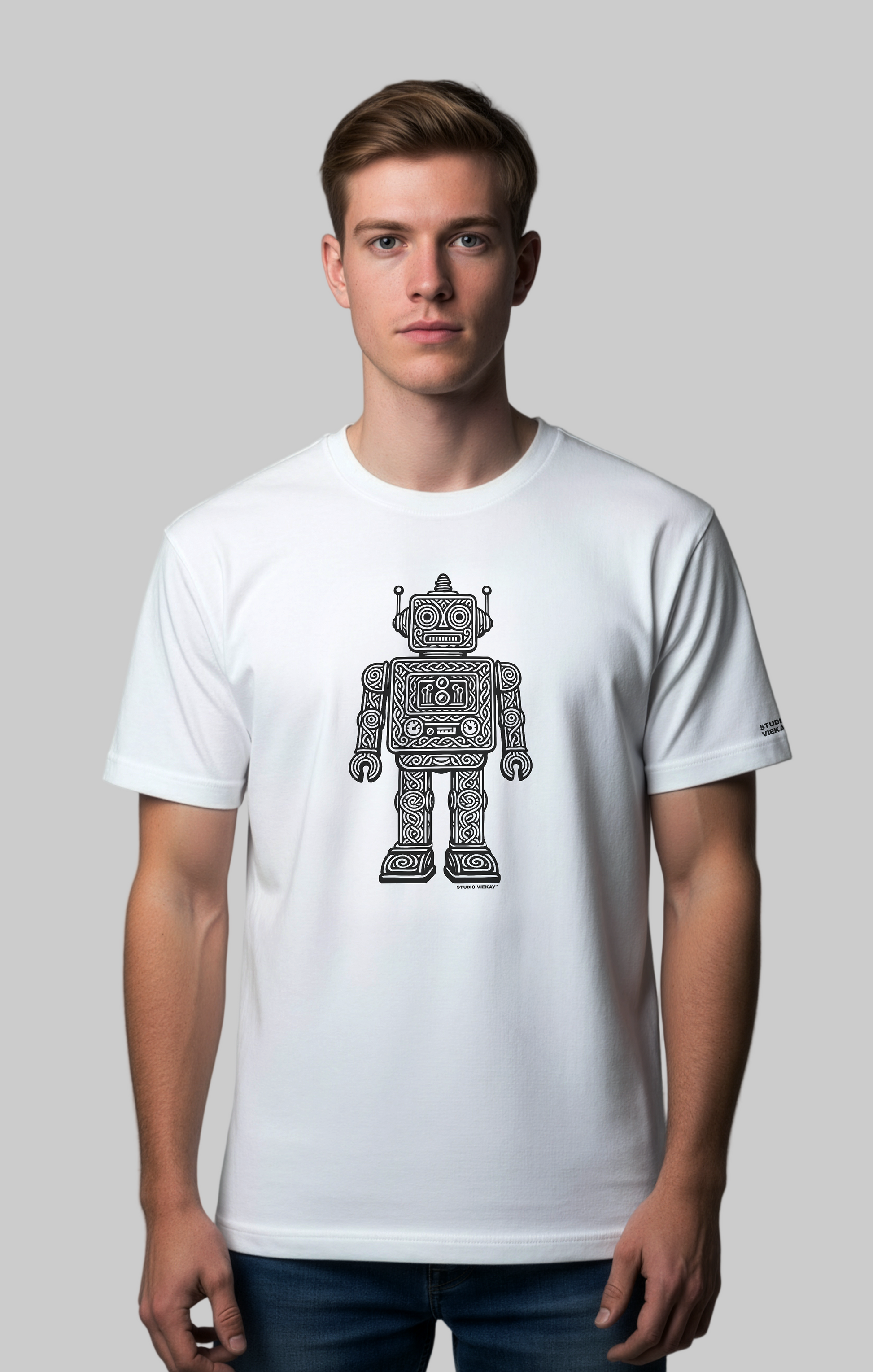 Model wearing white standard fit tee with carved black and white robot artwork in soft editorial light