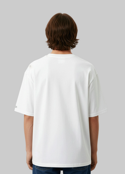 Back view of a model wearing a Studio Viekay white t-shirt against a light gray background