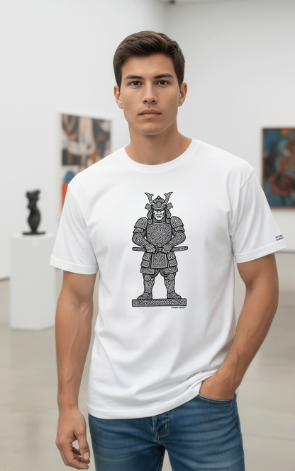 Model wearing a Studio Viekay white t-shirt with a Samurai graphic design in an art gallery.