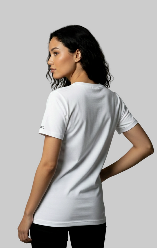 Back view a model wearing a white Studio VieKay tee against gray background.