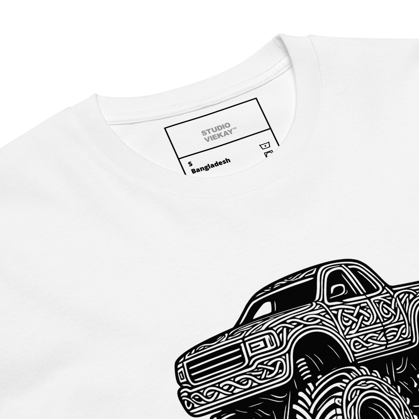 Close up comp of the Studio Viekay Monster Truck Engraved Art Tee showing the detailed carved black linework and premium monster truck artwork